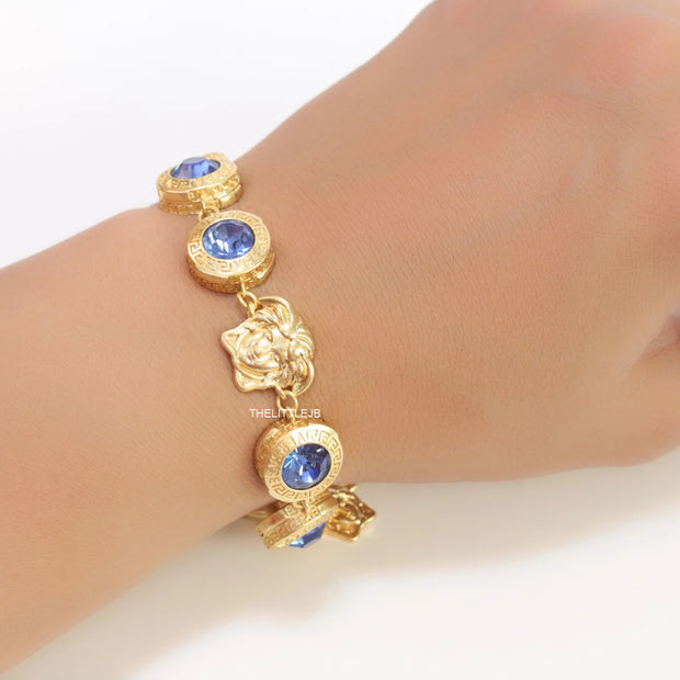 Designer golden Medusa chain bracelet with fancy cut cz