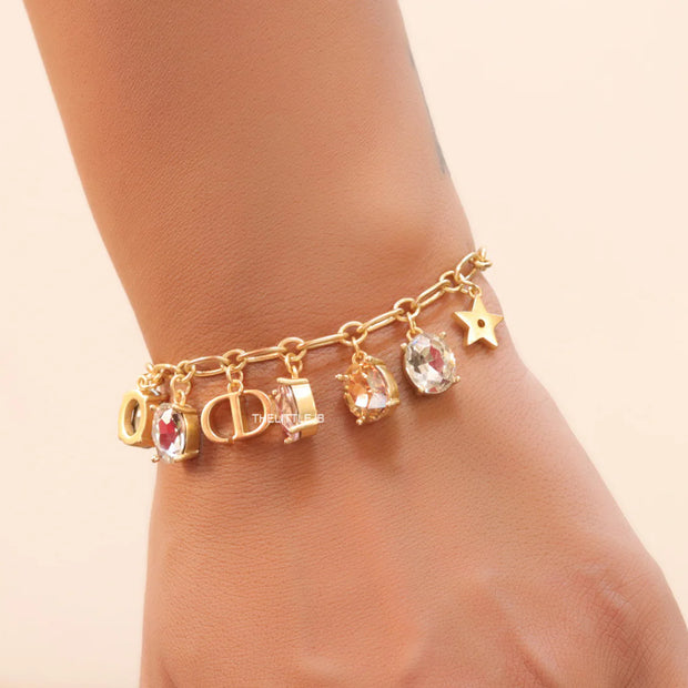 Golden chain bracelet with alphabet and cz charms