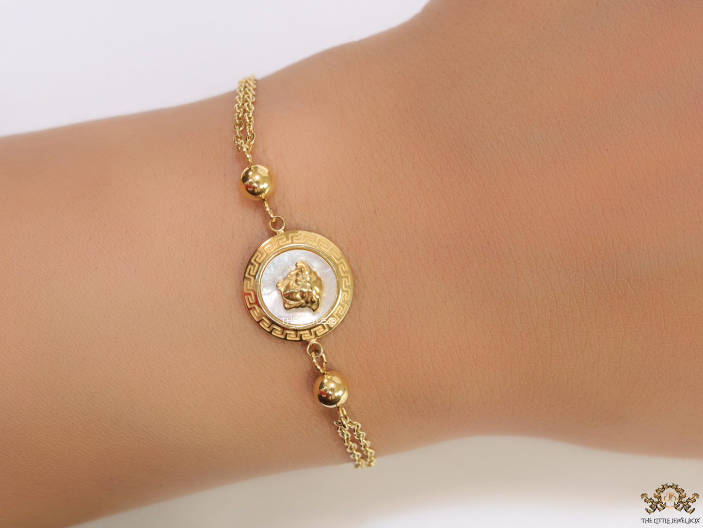 Double chain Medusa bracelet in gold