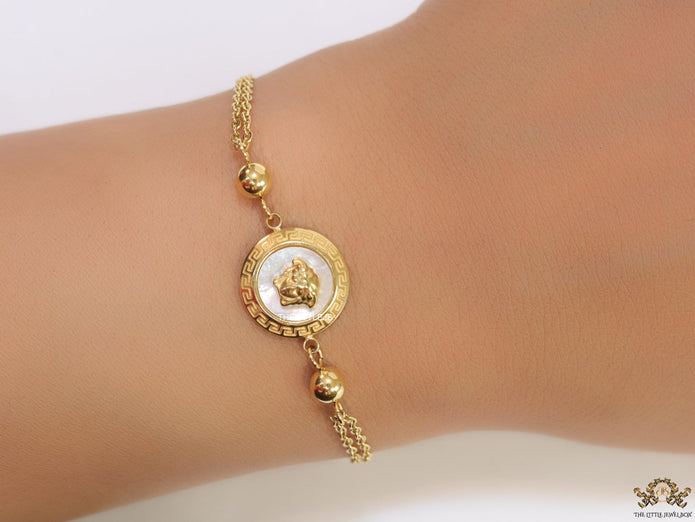 Double chain Medusa bracelet in gold
