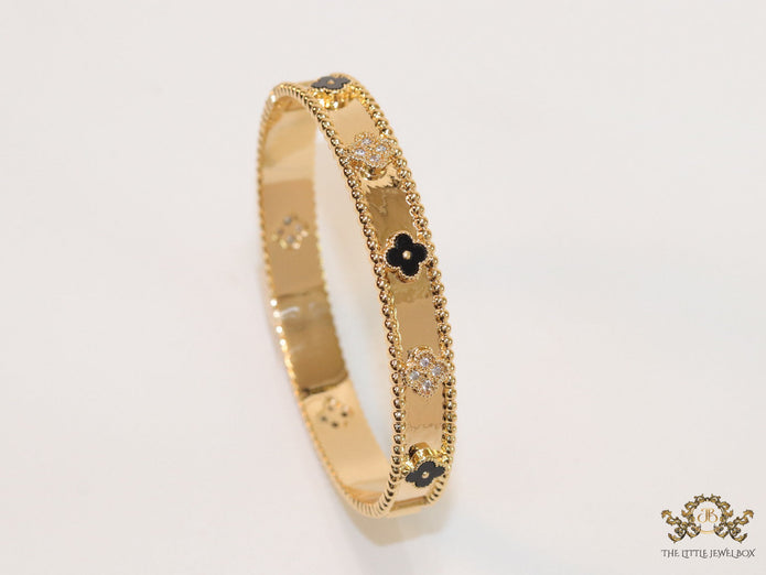 Gold plated bracelet with clover motifs in cz and black enamel