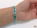 Twin G motif malachite green bracelet in matt gold finish