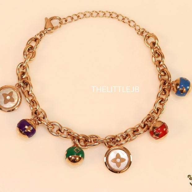 Rose gold plated link chain bracelet with multi enamel and MOP charms