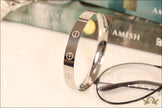 Men's bracelet with screws in platinum finish