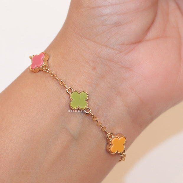 Golden chain bracelet with multi colored clovers
