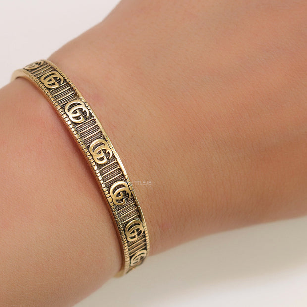 Open Gold plated double G motif bracelet in antique finish