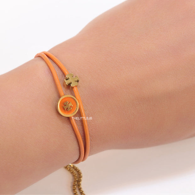 Adjustable double string orange bracelet with twin T motifs