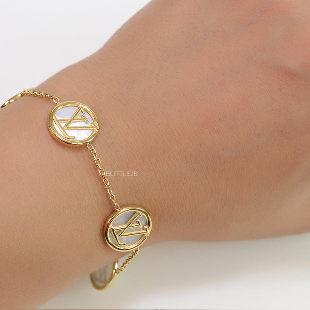 Gold plated sleek chain bracelet with MOP discs