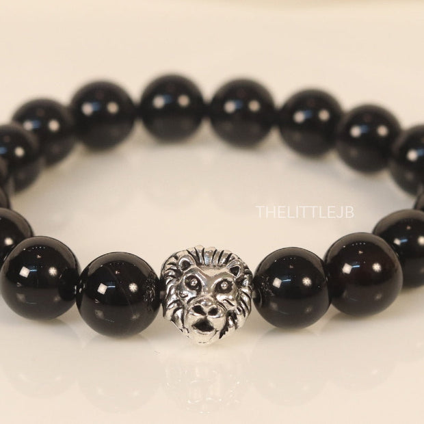 Glossy onyx beads bracelet with lion motif