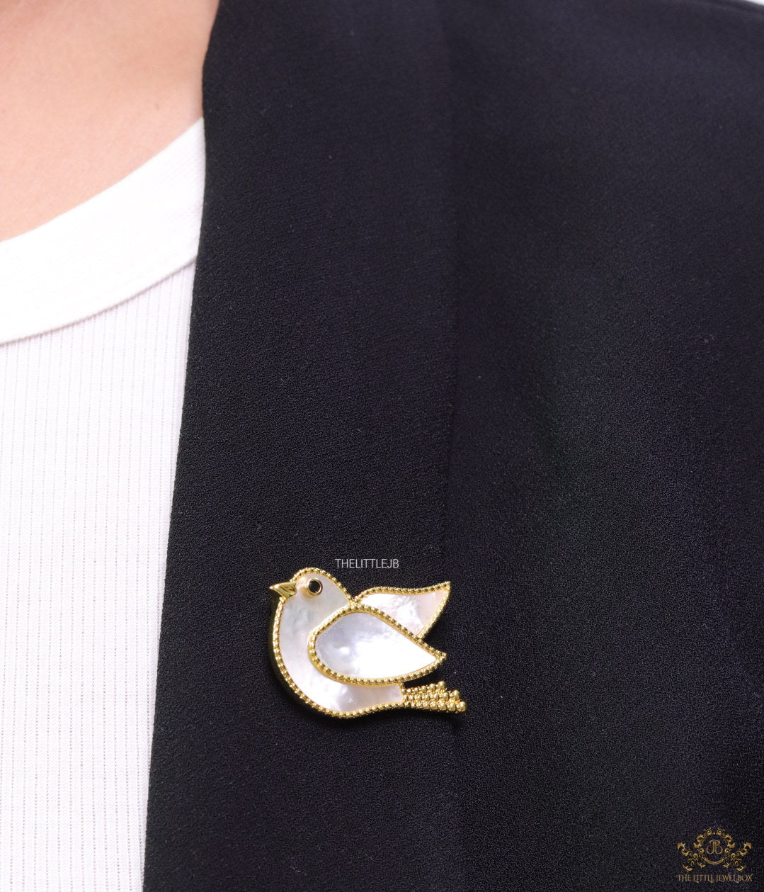 Gold plated white bird brooch