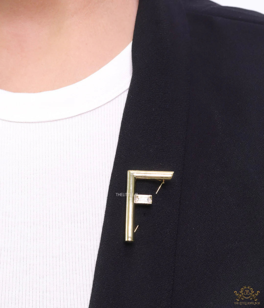 Gold plated alphabet F brooch with baguette cubic zirconia stone