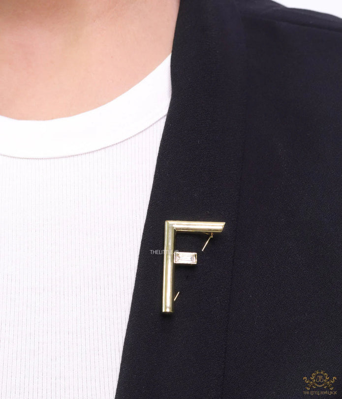 Gold plated alphabet F brooch with baguette cubic zirconia stone