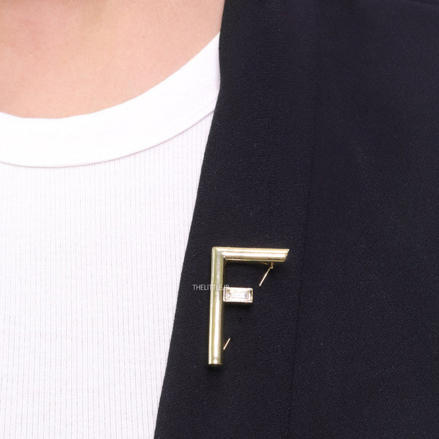 Gold plated alphabet F brooch with baguette cubic zirconia stone