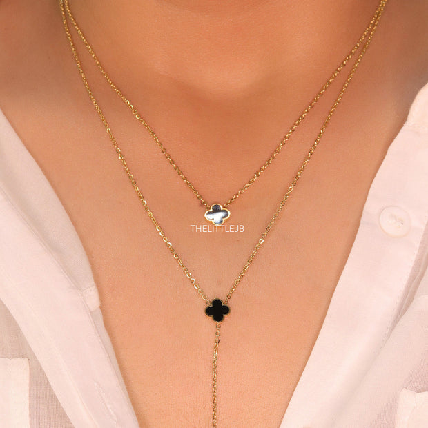 Dual chain necklace with black onyx clovers in gold finish