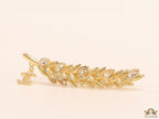Golden feather brooch with fancy cz and twin C charm
