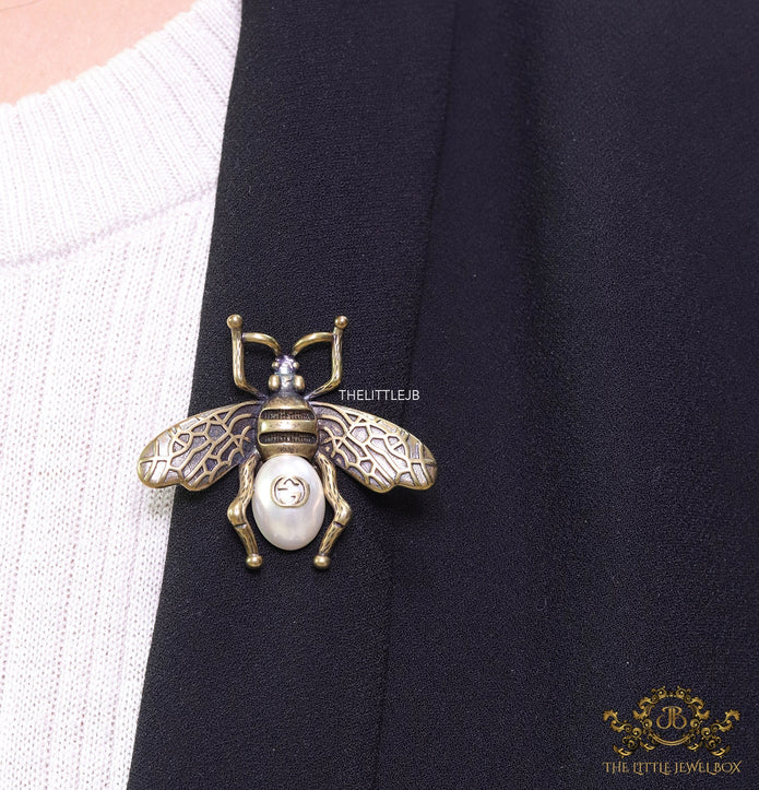 Antique gold finish alphabet bee brooch