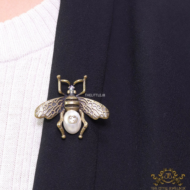 Antique gold finish alphabet bee brooch