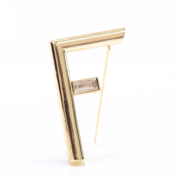 Gold plated alphabet F brooch with baguette cubic zirconia stone
