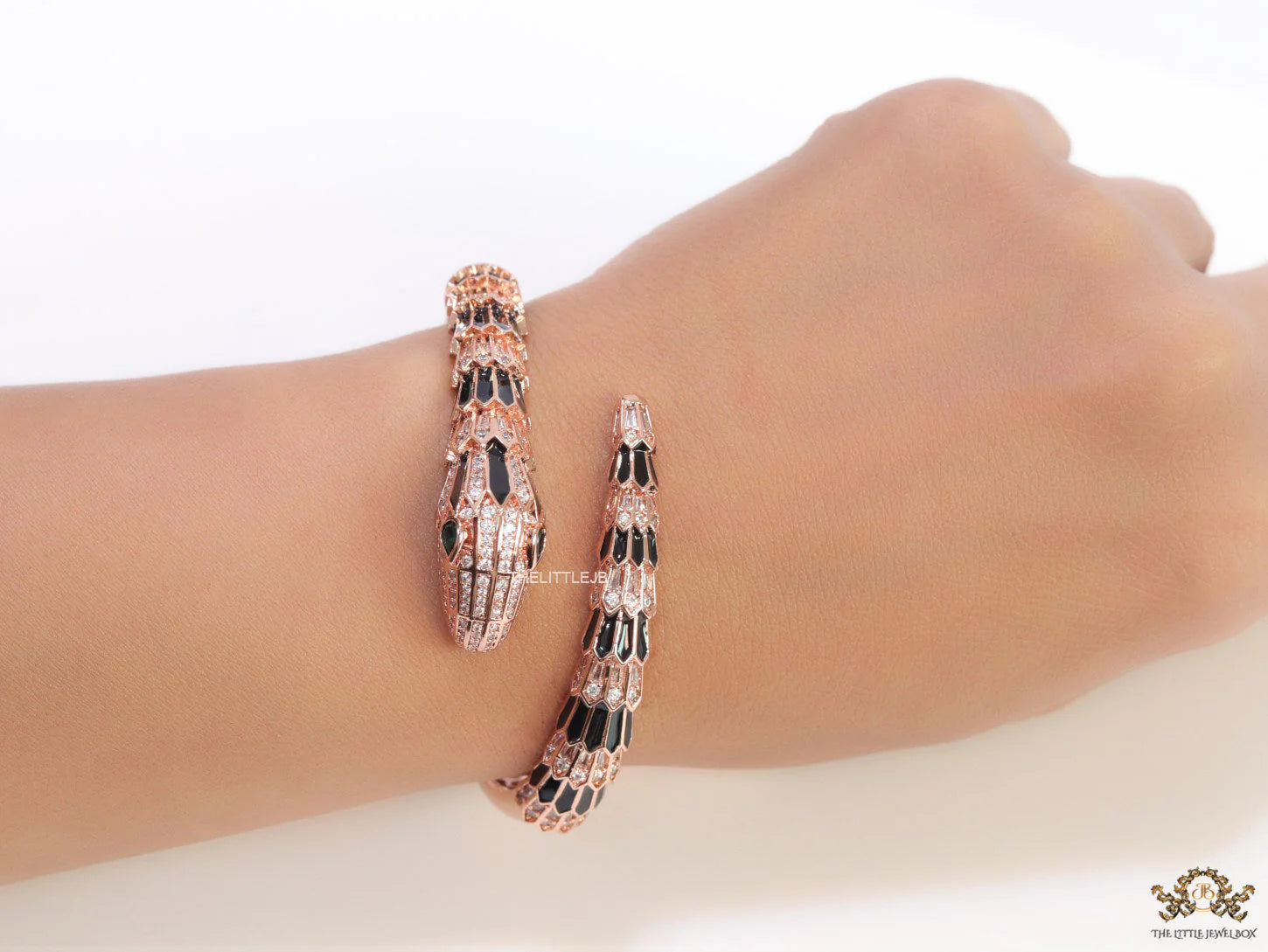 Top open snake black enamel bracelet with rose gold plating and cubic zirconia stones