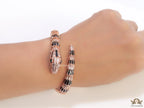 Top open snake black enamel bracelet with rose gold plating and cubic zirconia stones