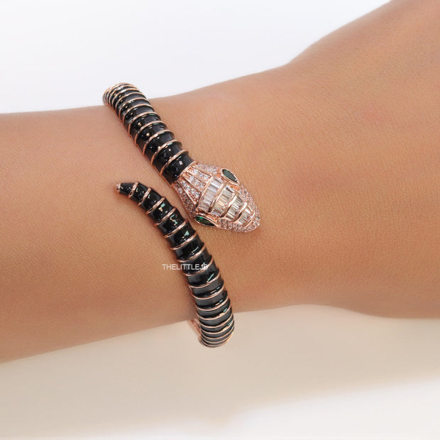 Top open serpentine bracelet in black enamel with rose gold plated details and cubic zirconia stones head
