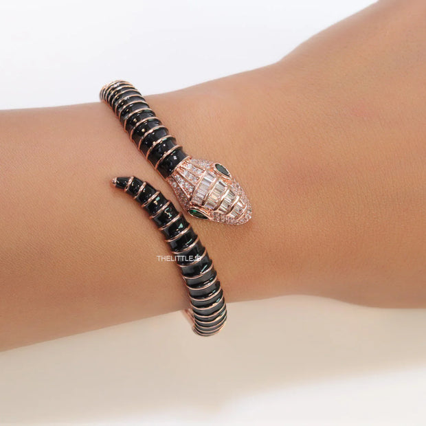 Top open serpentine bracelet in black enamel with rose gold plated details and cubic zirconia stones head