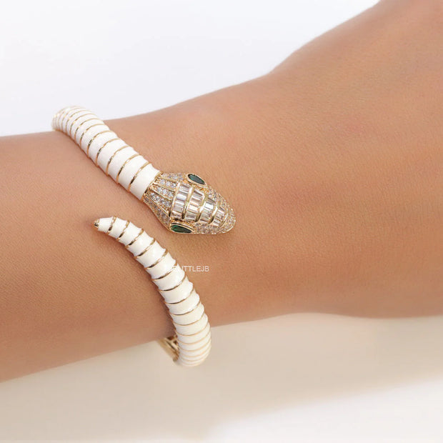 Top open snake bracelet in white enamel with rose gold plated details and cubic zirconia stones head