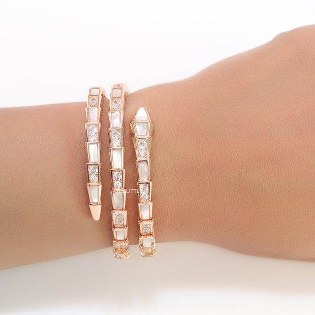 Triple line rose gold plated minimal snake bracelet with cubic zirconia stones and pearl white stones.