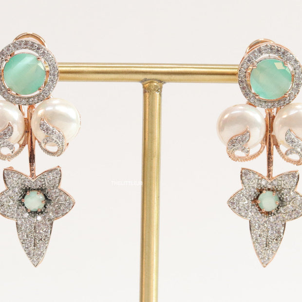 Cz flower earrings with shell pearls and light green stones