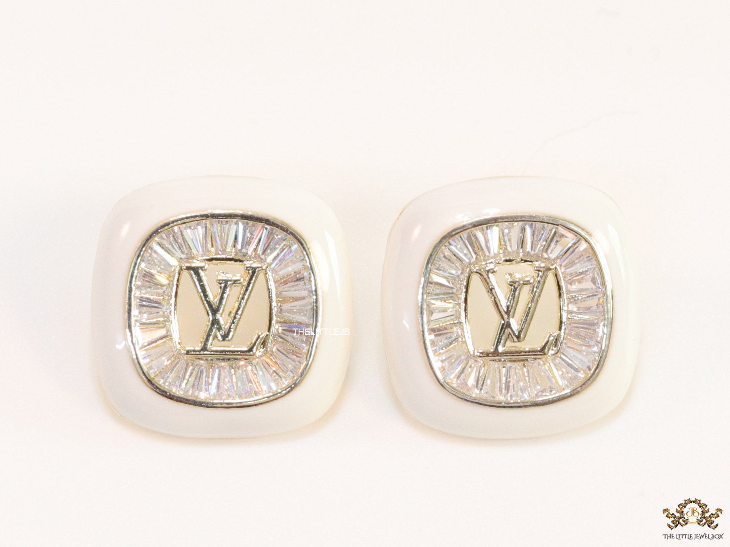 Golden and white square studs with alphabets and cz baguettes