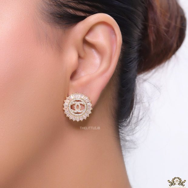 Round gold studs lined with cz baguettes and twin C cz motif centre