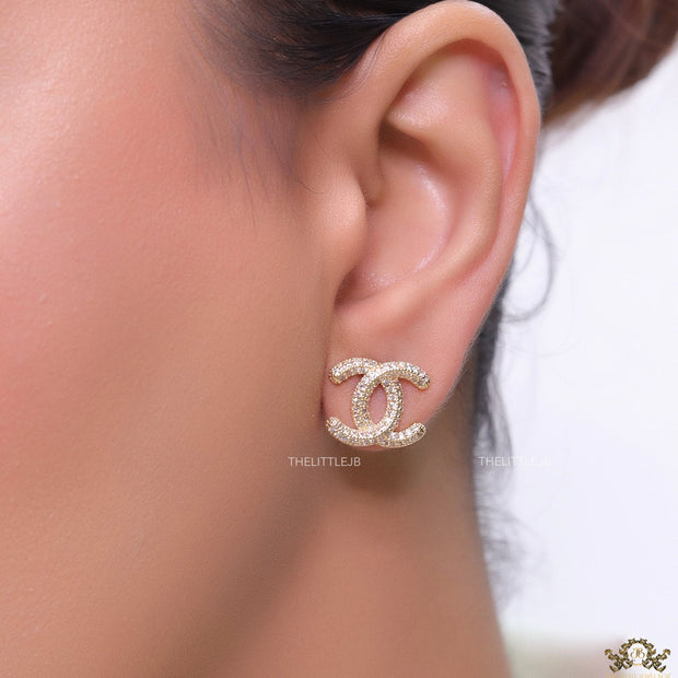 Gold plated twin C motif studs with cz