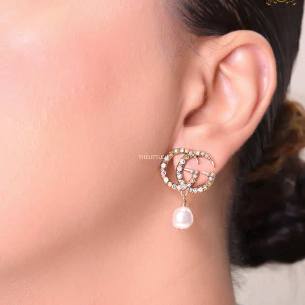 Double G golden earrings with multi color cz stones and pearl