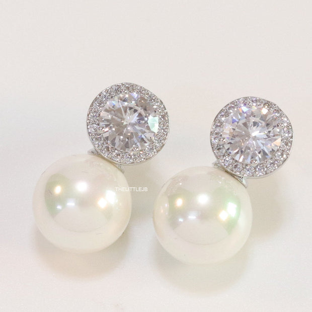 Platinum plated round cz earrings with pearl drop