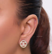 Round golden studs lined with cz and twin C motif centre