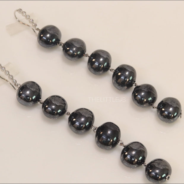 Charcoal grey shell pearl danglers