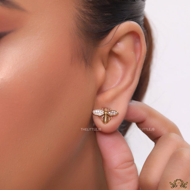 Designer pearl earrings with matte gold flying bee motifs