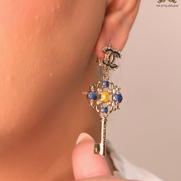 Gold plated key earrings with double C motif and clovers