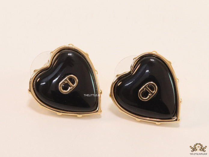 Heart shape black stud earrings with golden alphabets