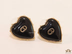Heart shape black stud earrings with golden alphabets