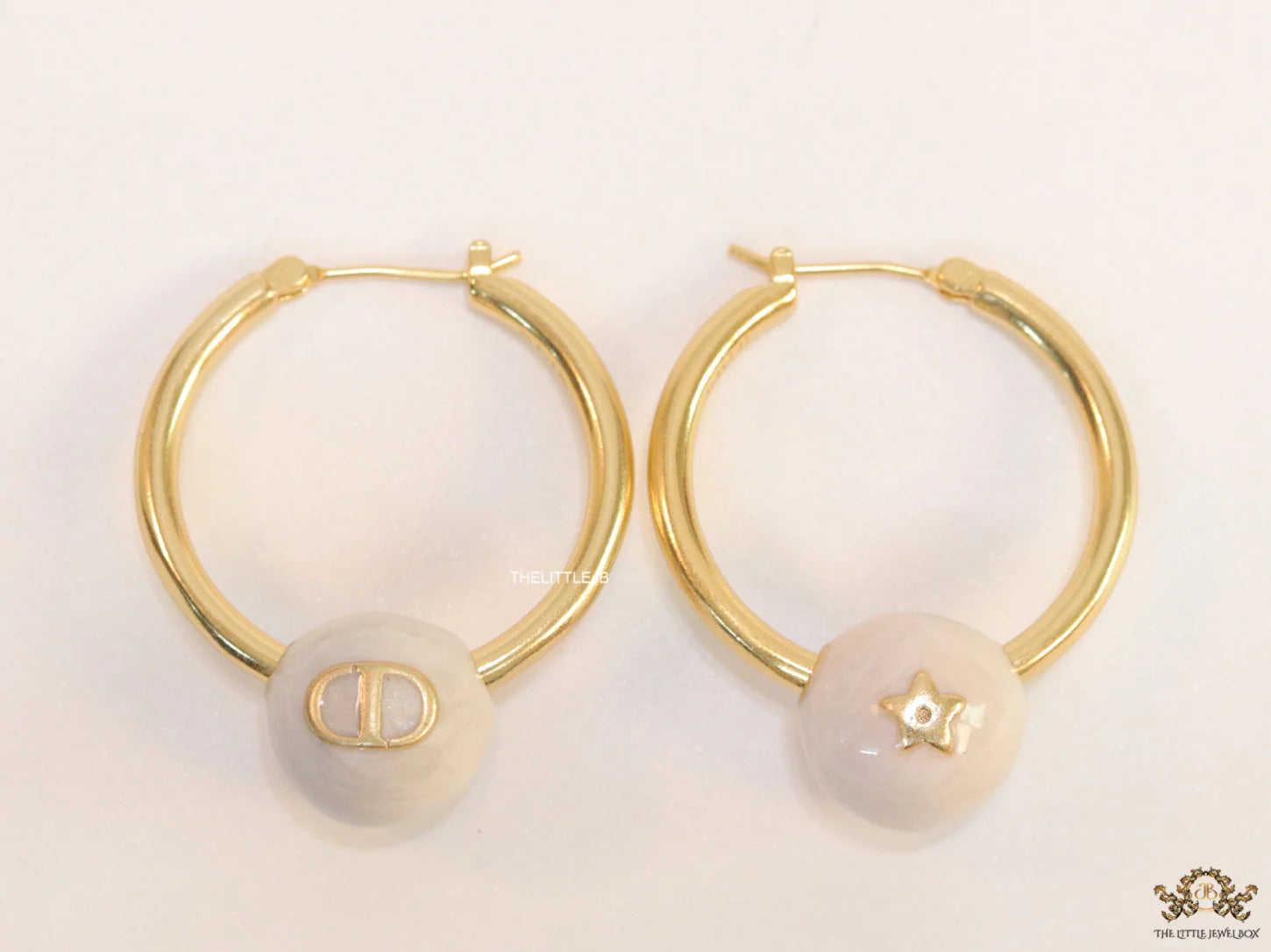 Golden hoops with pearl drops