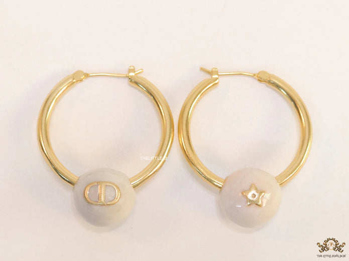 Golden hoops with pearl drops