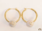 Golden hoops with pearl drops