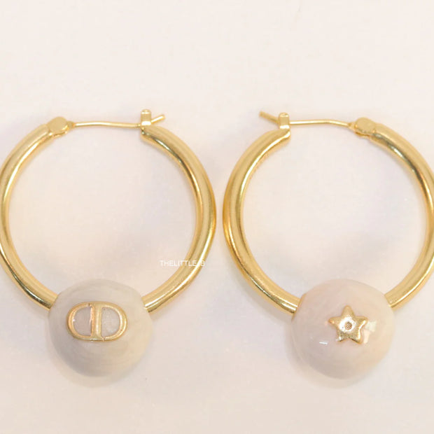 Golden hoops with pearl drops