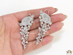 Cz and baguette dangles in platinum finish