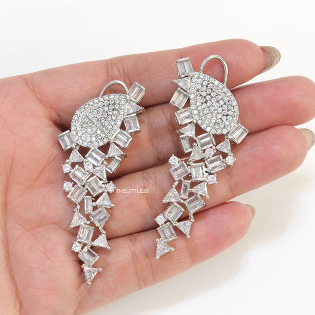 Cz and baguette dangles in platinum finish