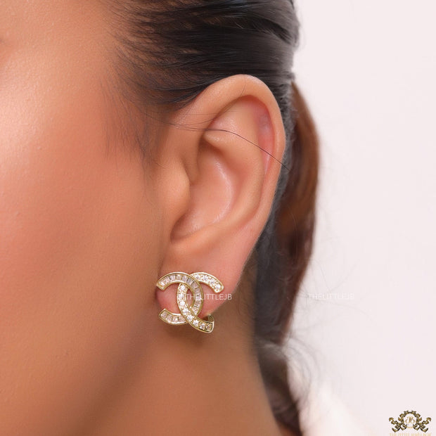 Gold plated twin C motif studs in cz and baguettes
