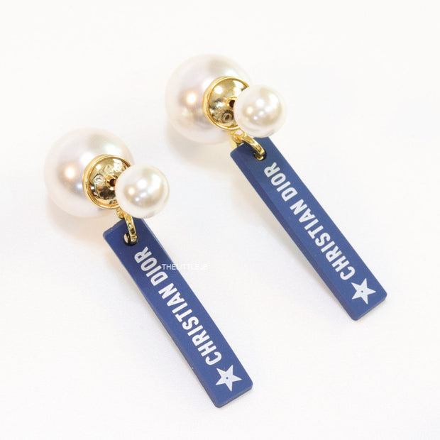 Blue silicon lapel drops with branding on pearl bomber studs