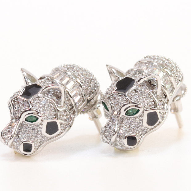 Asymmetrical cz and baguette panther studs in platinum finish