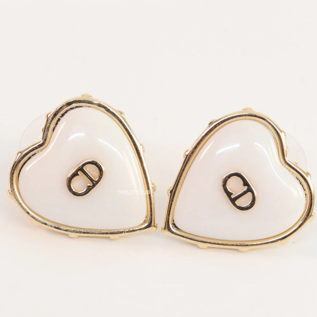 Heart shape white stud earrings with golden alphabets